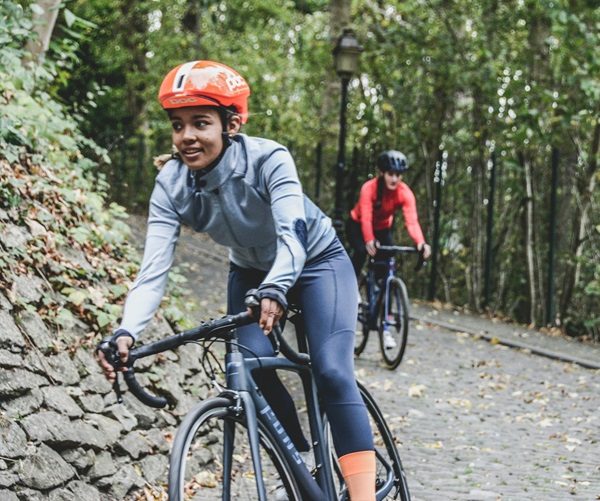 Tow woman cycling on race bikes in the countryside